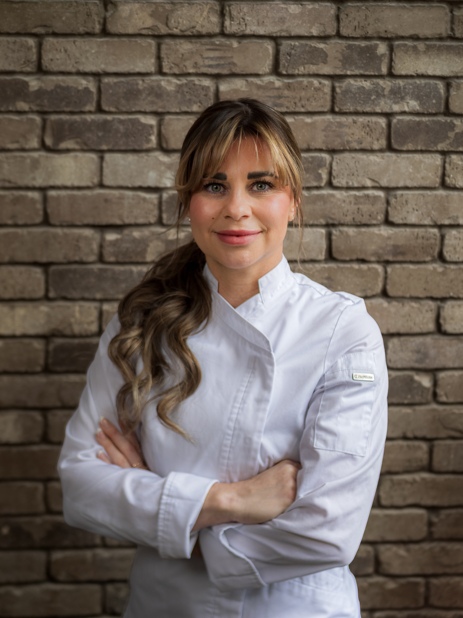 Chef Rochelle Daniele portrait in chef coat